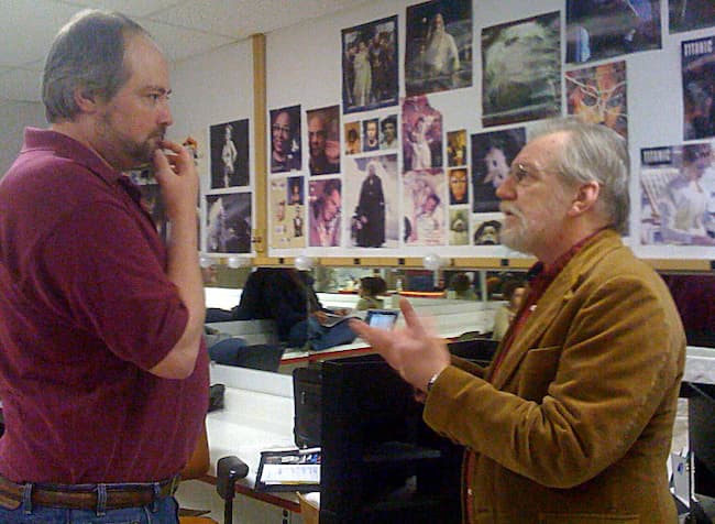 Discussing the design for a production with the director.