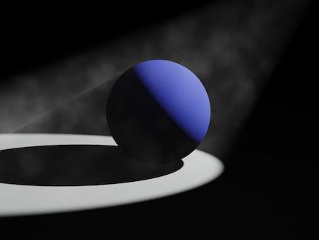 White light reflecting off of a blue  ball.